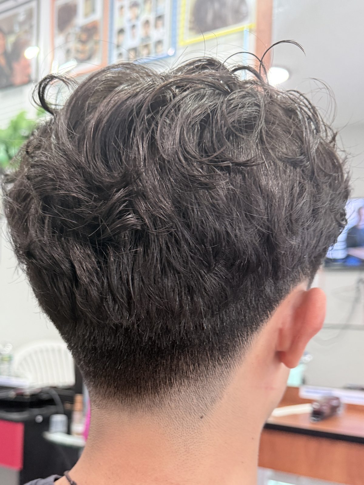 Men's textured cut with a skin fade at Simple Cuts Framingham by Hannah